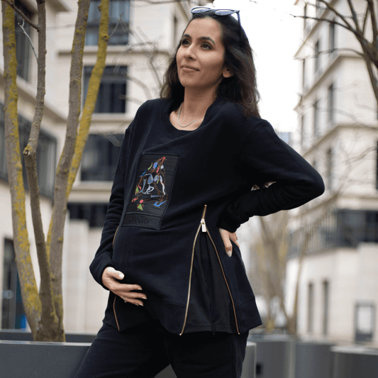 Pregnant woman outdoors in The Better Sweater 